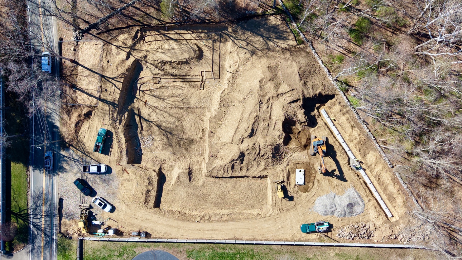 Aerial view of an active dB Development construction site — site preparation and foundation work